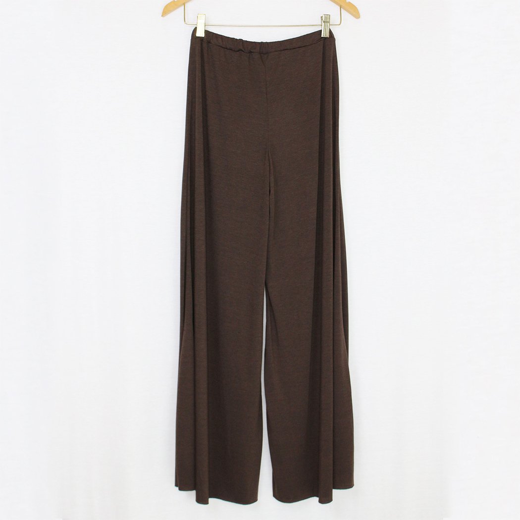 Brown elastic waist wide leg pants displayed on a hanger, showcasing their stylish design and comfortable fit.