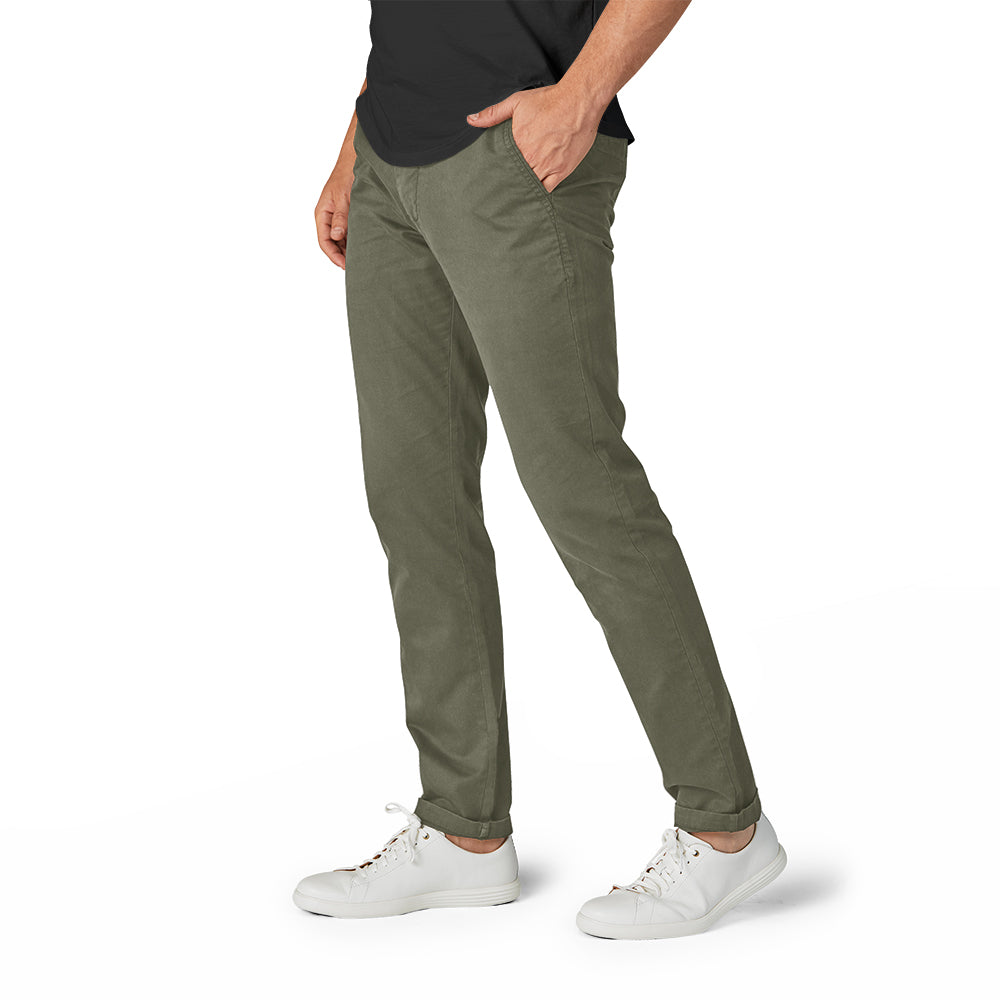 A pair of olive camo chinos designed for active men, showcasing a slim tapered fit and comfortable fabric.