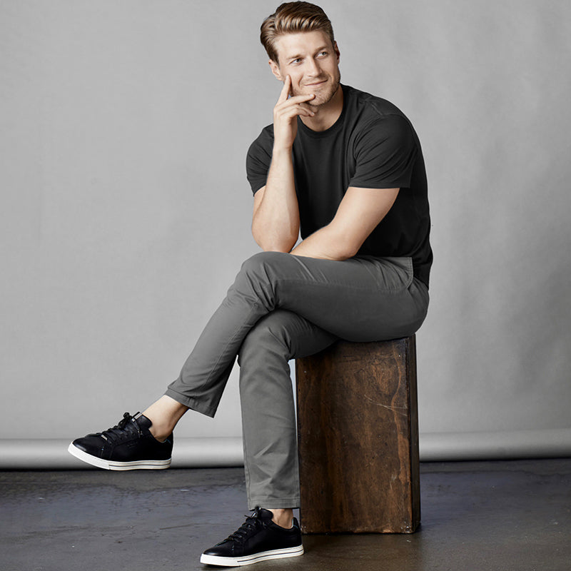 Feel Good Chinos in Faded Black, showcasing a modern slim tapered fit with a soft and breathable fabric.