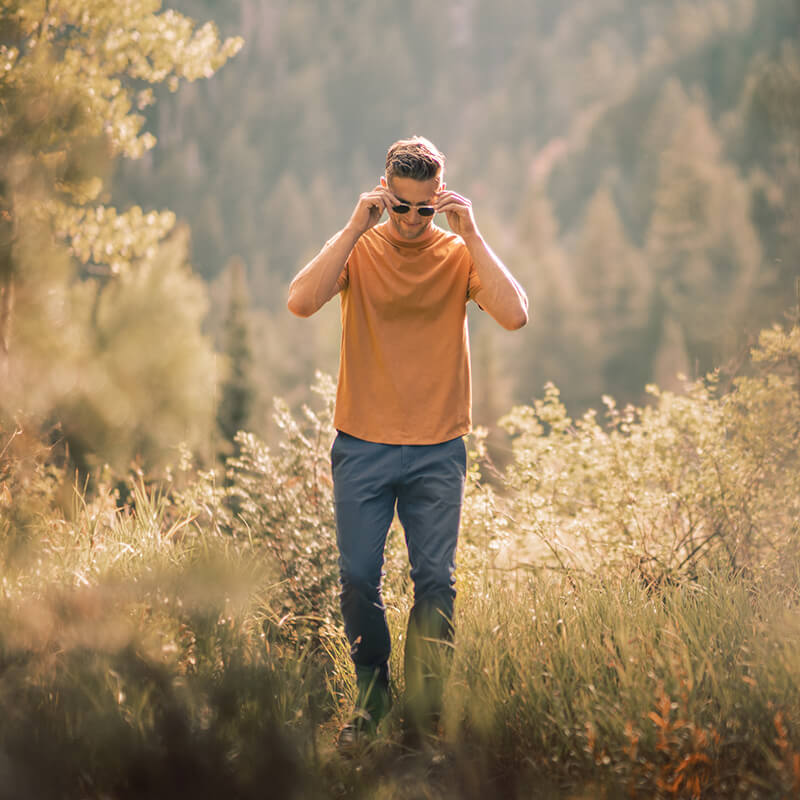 A pair of Feel Good Riverside Blue Chinos displayed on a neutral background, showcasing their slim tapered design and soft fabric.