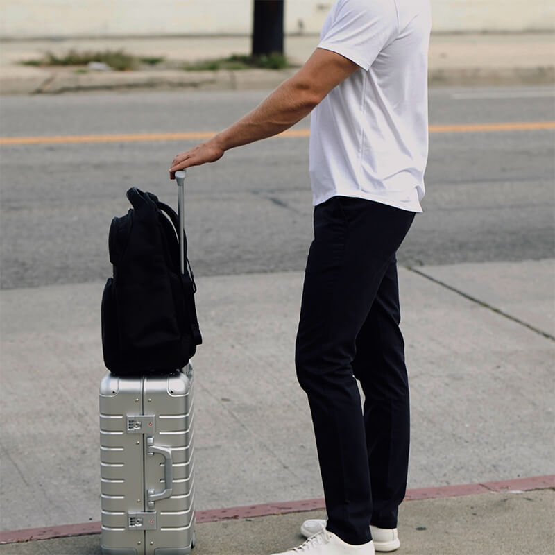 A pair of stylish Feel Good Solid Black Chinos displayed on a neutral background, showcasing their slim tapered fit and soft fabric.