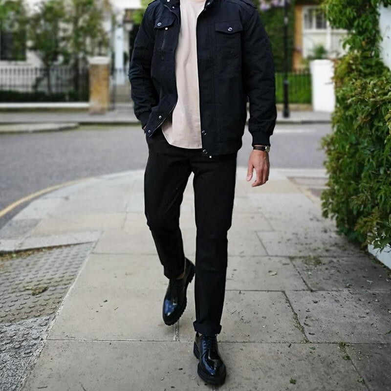 A pair of stylish Feel Good Solid Black Chinos displayed on a neutral background, showcasing their slim tapered fit and soft fabric.