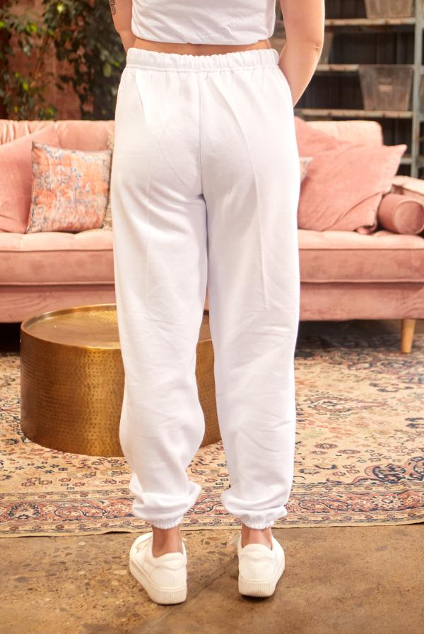 White and gray joggers with 'B.R.I.D.E' and 'A.M.I.G.A.S' text, perfect for bachelorette parties.