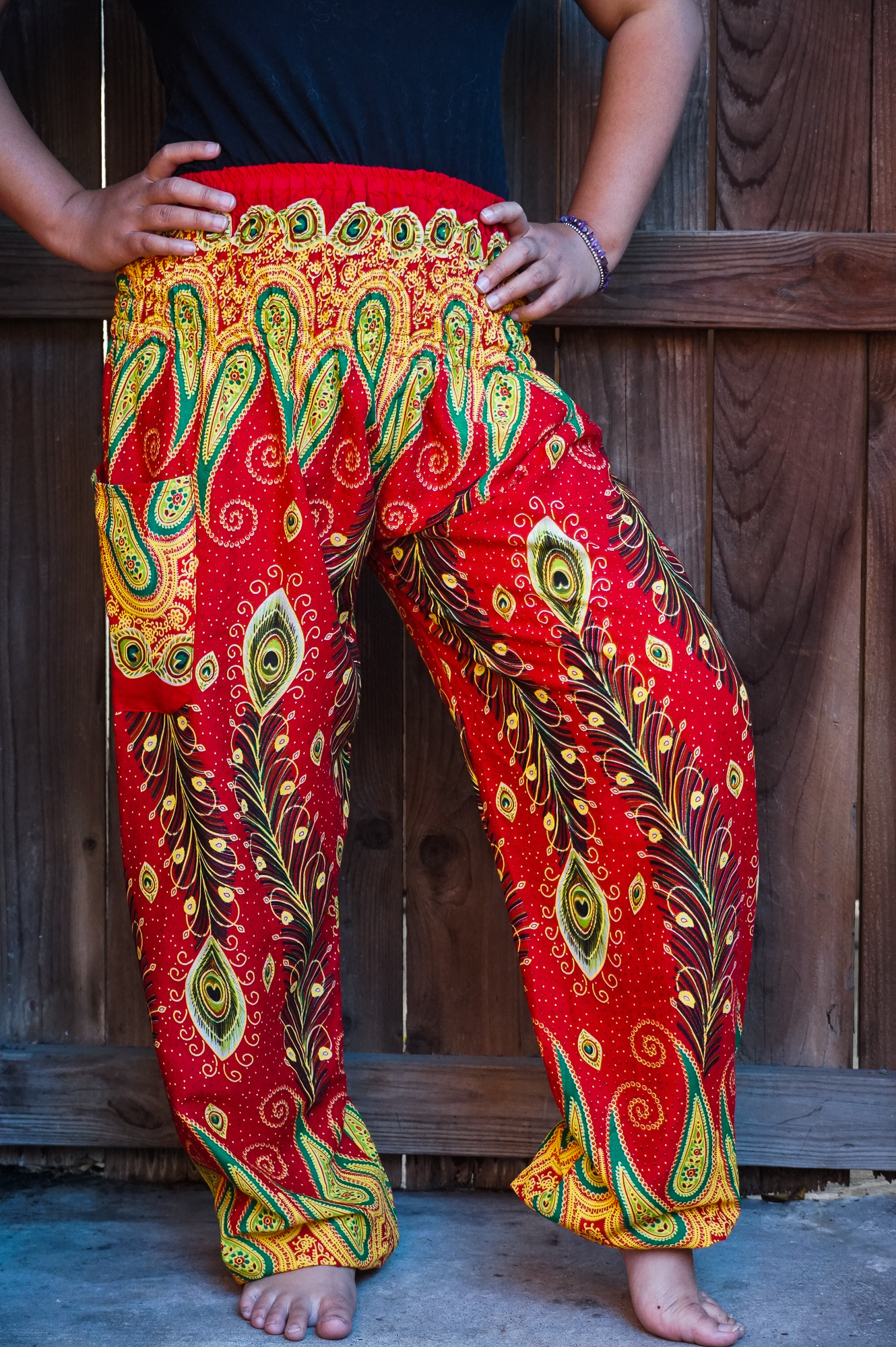 New Orange Peacock Boho Hippie Gypsy Pants featuring a vibrant peacock pattern, elastic waist, and ankle for a comfortable fit.