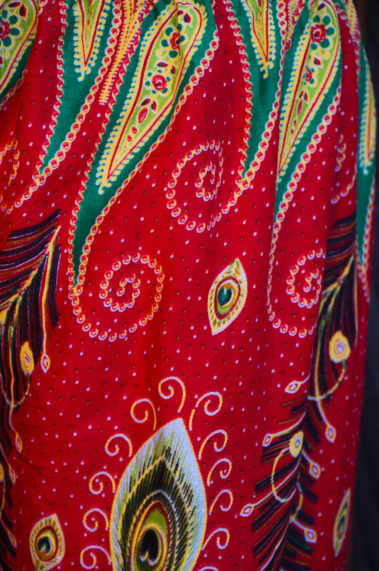 New Orange Peacock Boho Hippie Gypsy Pants featuring a vibrant peacock pattern, elastic waist, and ankle for a comfortable fit.