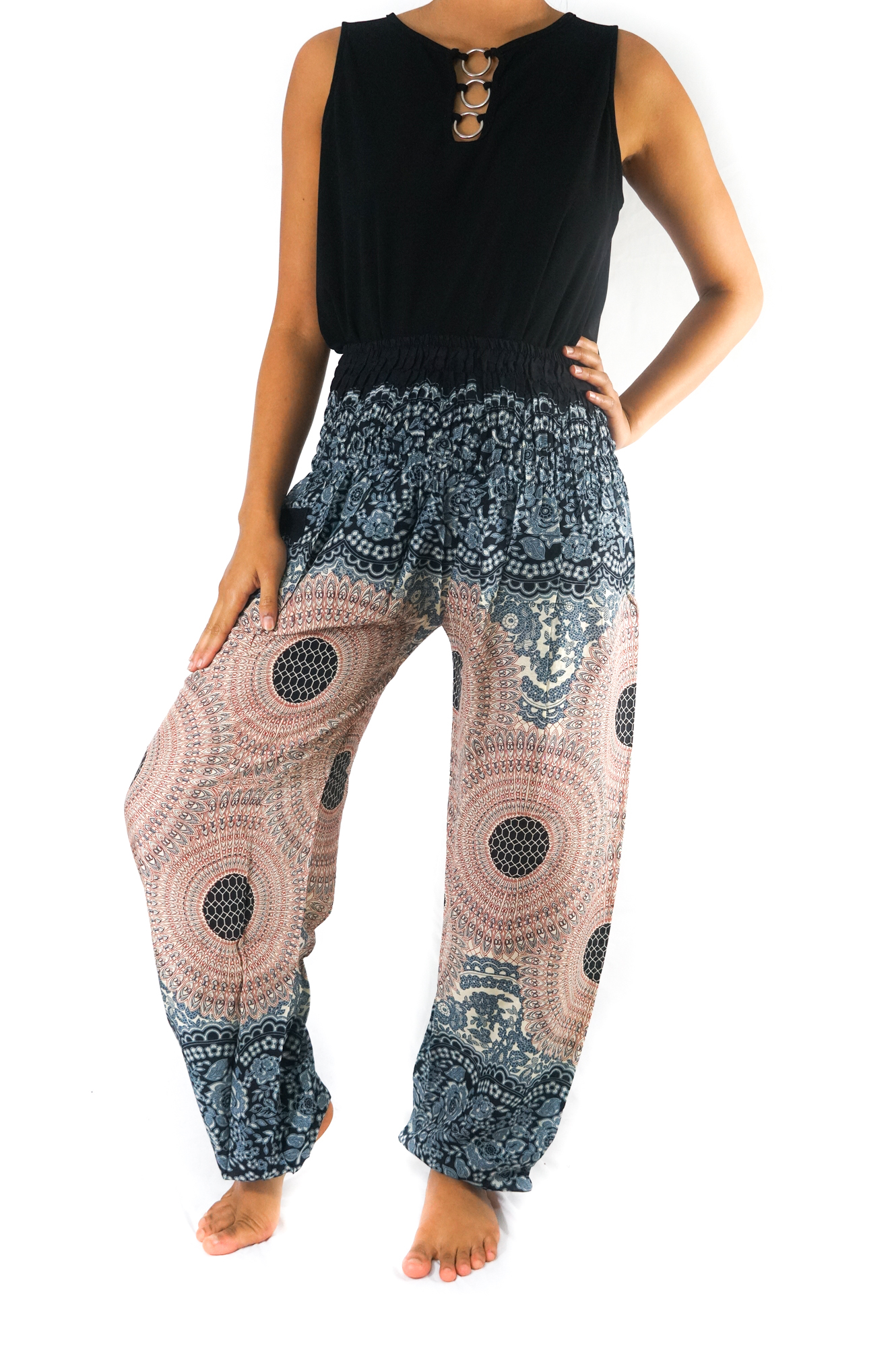 A pair of Pink MANDALA Women Boho Pants featuring a vibrant mandala pattern, elastic waist, and ankle cuffs, perfect for yoga and casual wear.