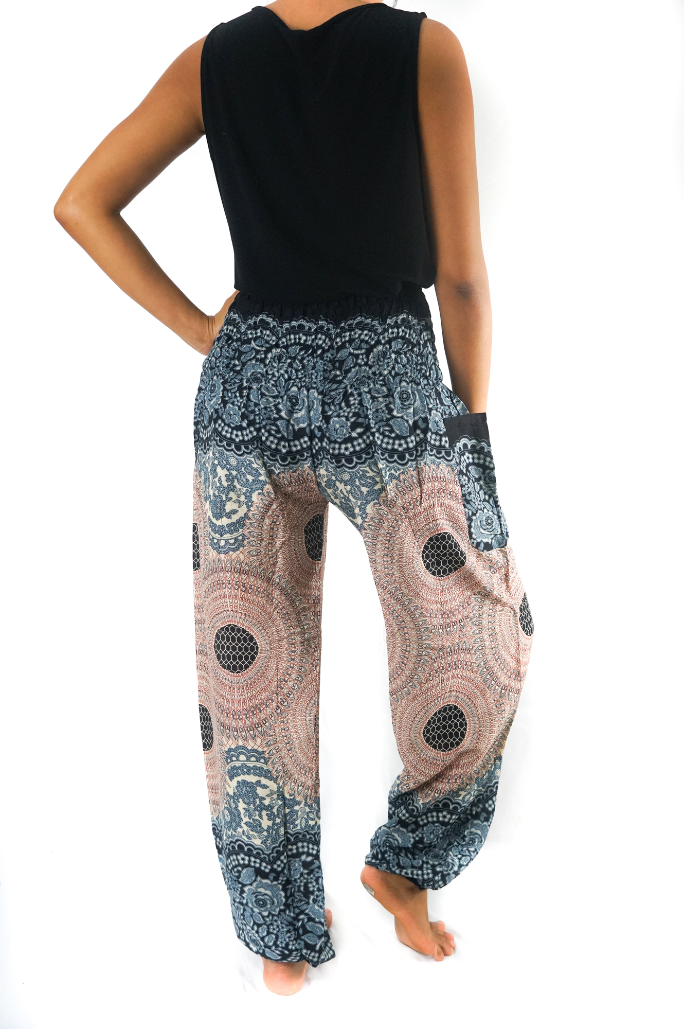 A pair of Pink MANDALA Women Boho Pants featuring a vibrant mandala pattern, elastic waist, and ankle cuffs, perfect for yoga and casual wear.