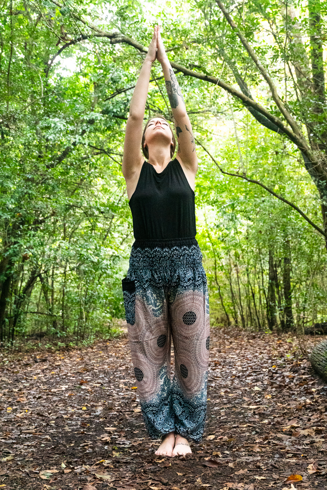 A pair of Pink MANDALA Women Boho Pants featuring a vibrant mandala pattern, elastic waist, and ankle cuffs, perfect for yoga and casual wear.