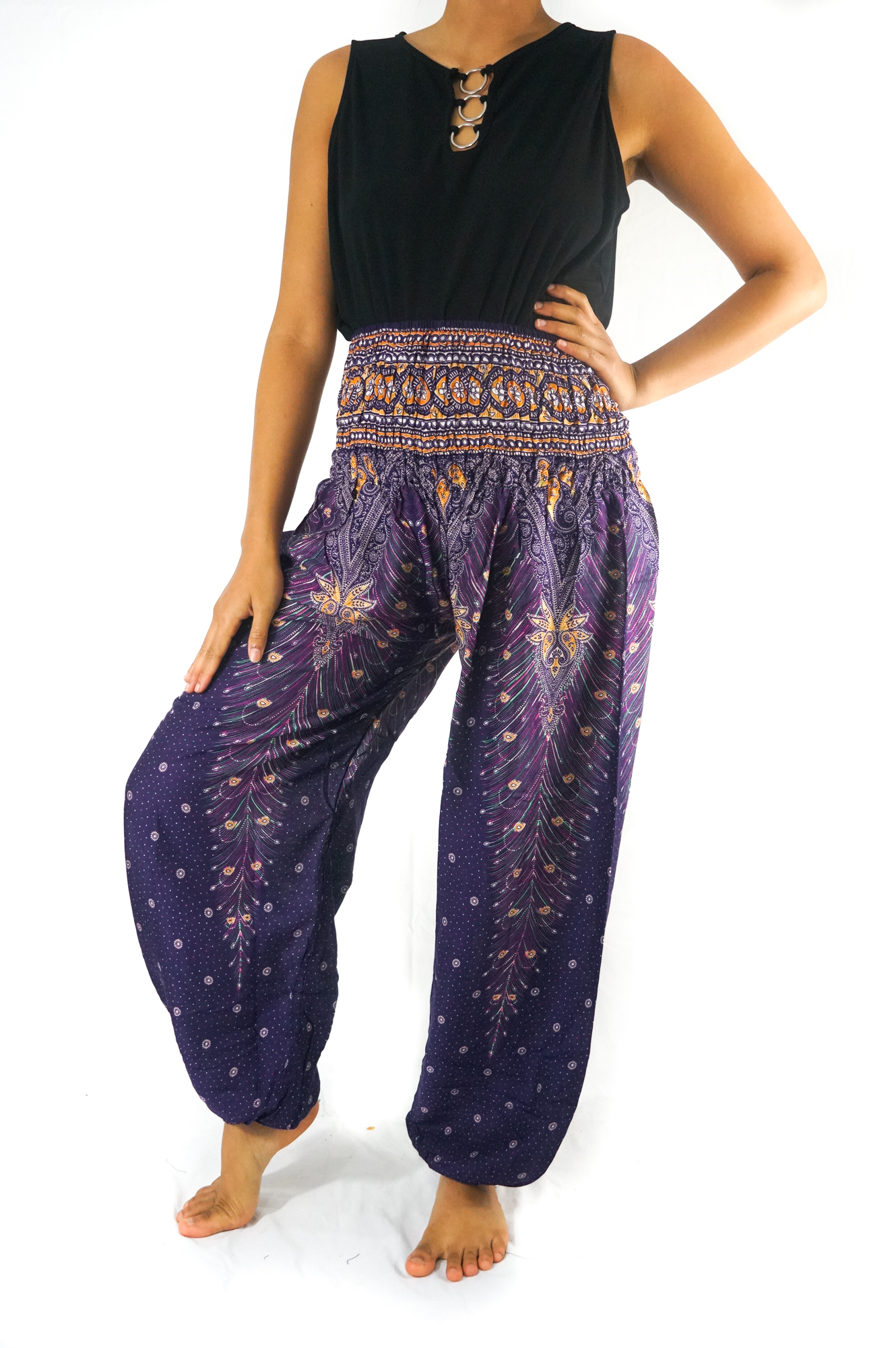 Purple PEACOCK Harem Pants for women, featuring a vibrant peacock print, elastic waist and ankle, and a side pocket, made from lightweight rayon.