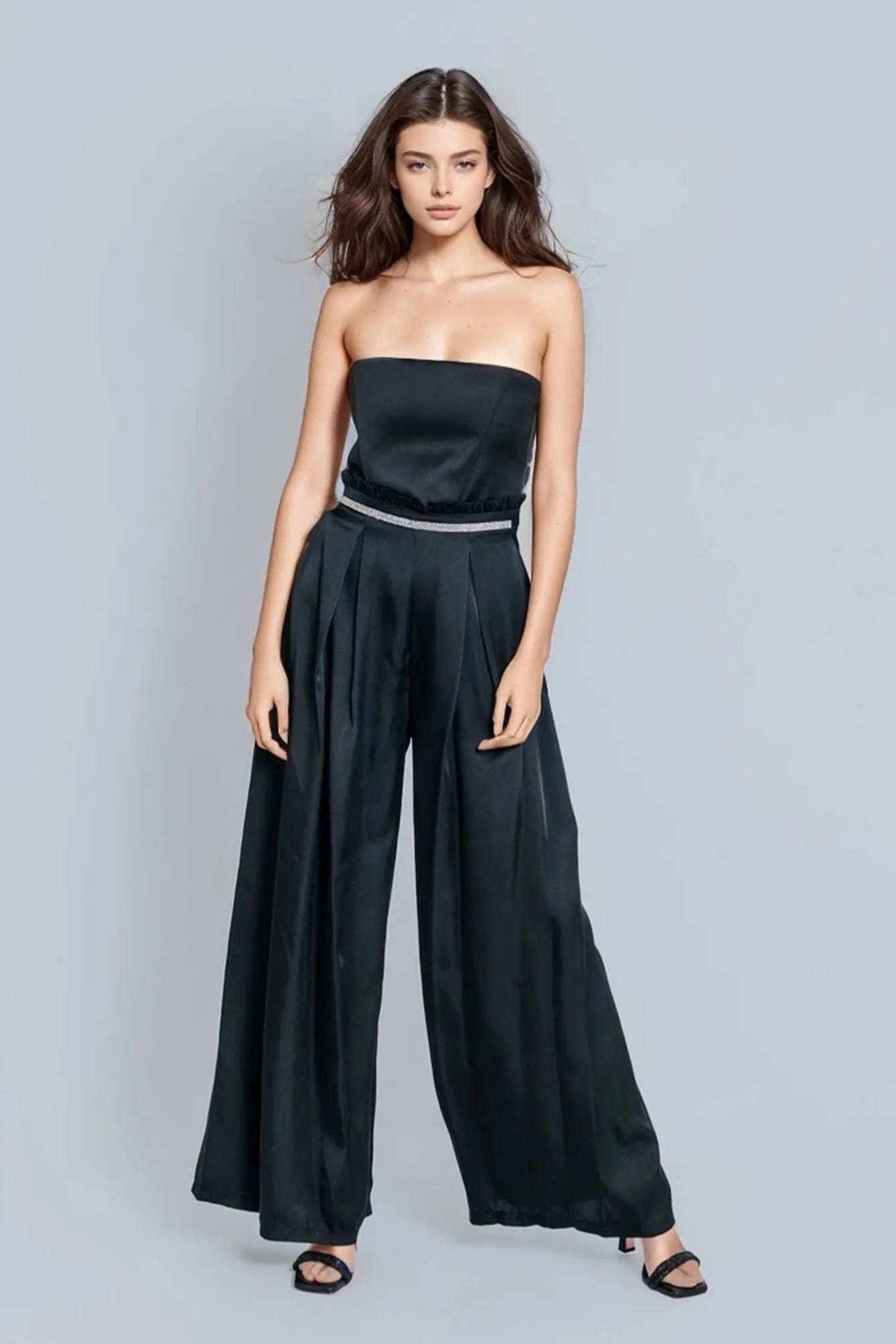 Reed Wide Leg Pants in black, featuring a high-rise design and wide-leg silhouette, made from a luxurious rayon satin blend.