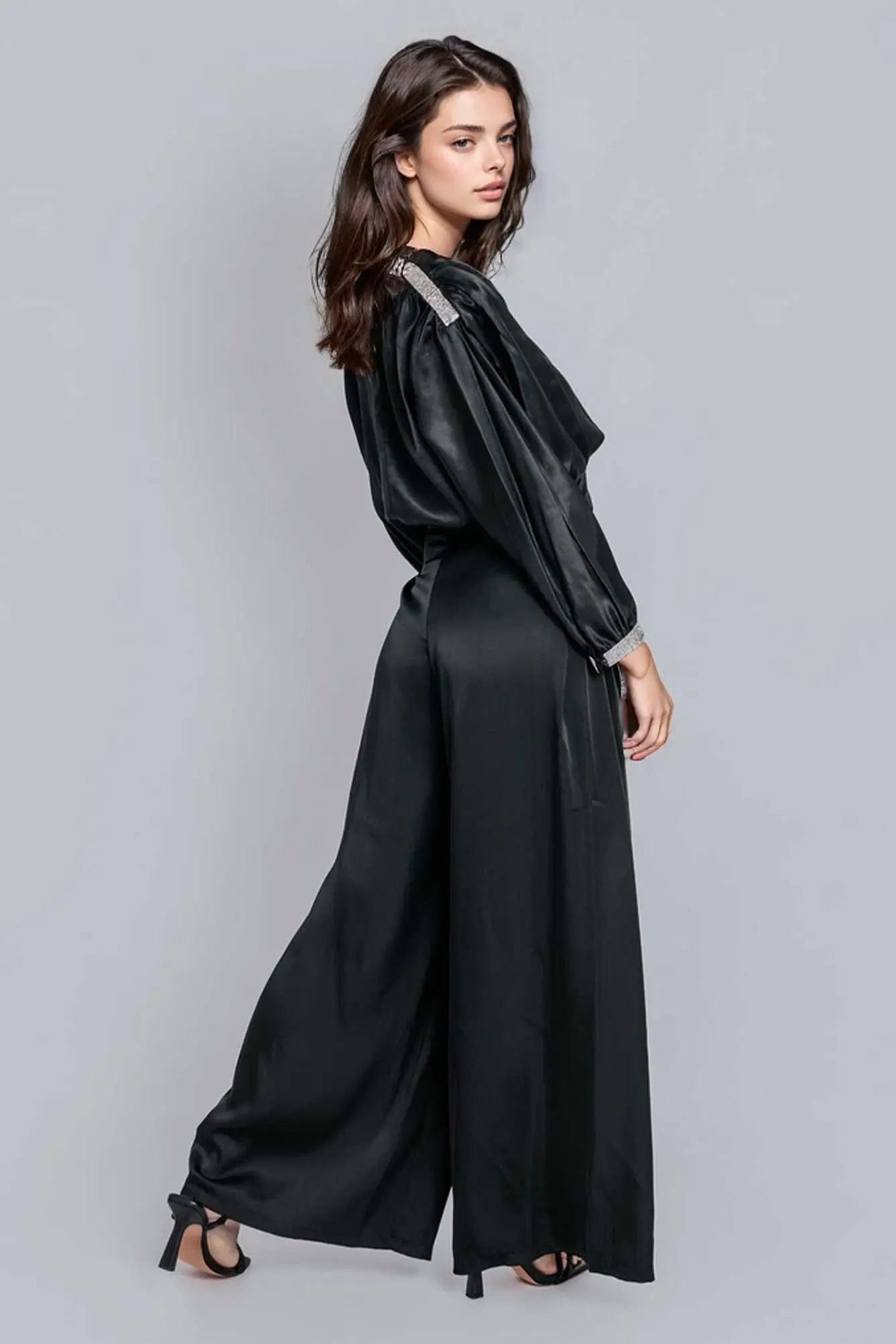 Reed Wide Leg Pants in black, featuring a high-rise design and wide-leg silhouette, made from a luxurious rayon satin blend.