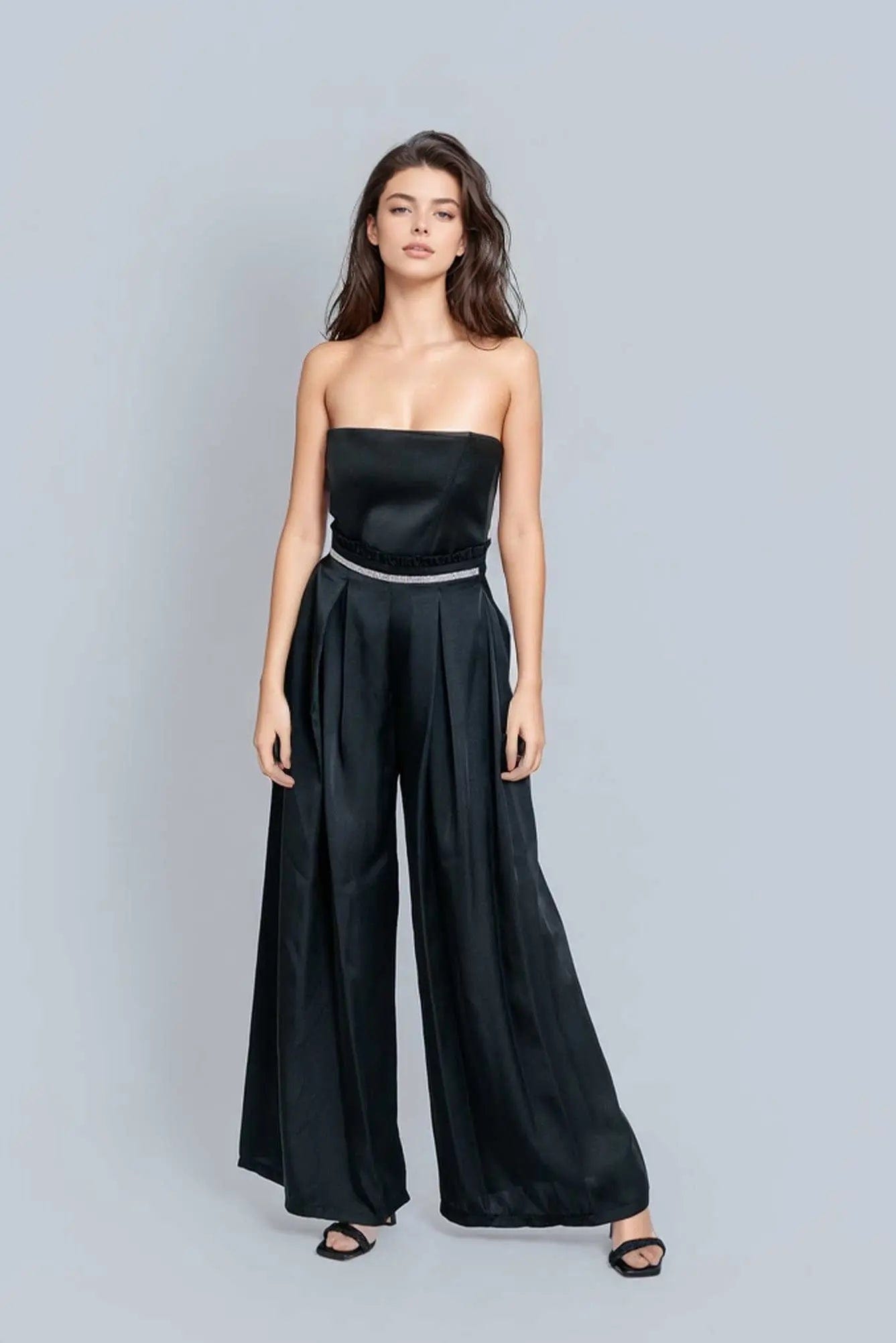 Reed Wide Leg Pants in black, featuring a high-rise design and wide-leg silhouette, made from a luxurious rayon satin blend.