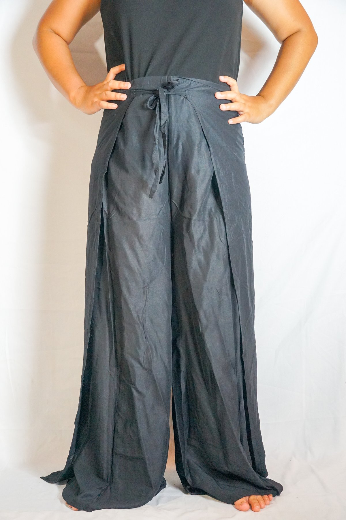 Solid Black Palazzo Wrap Pants featuring an open leg design, perfect for boho and hippie styles, made from breathable rayon fabric.