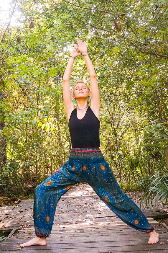 Teal PEACOCK Harem Pants for women, featuring a vibrant peacock print, elastic waist, and ankle design, perfect for boho and hippie styles.