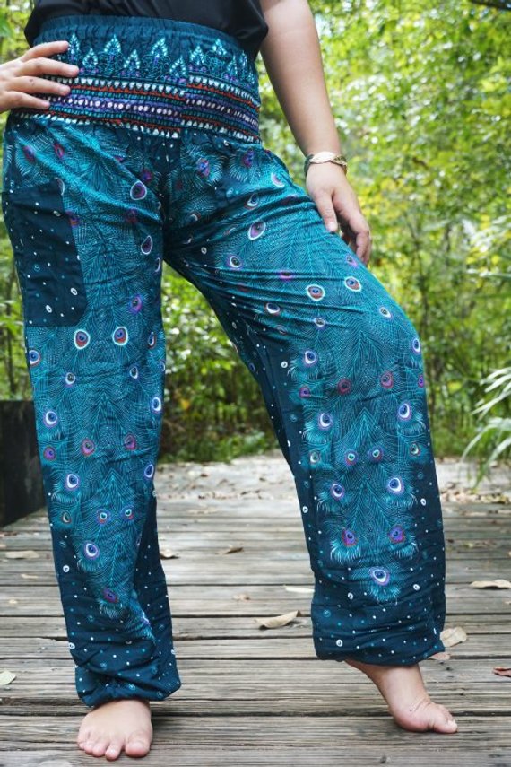 Teal PEACOCK Pants for women, featuring a vibrant peacock pattern, elastic waist, and ankle, made from lightweight breathable rayon, perfect for yoga and casual wear.