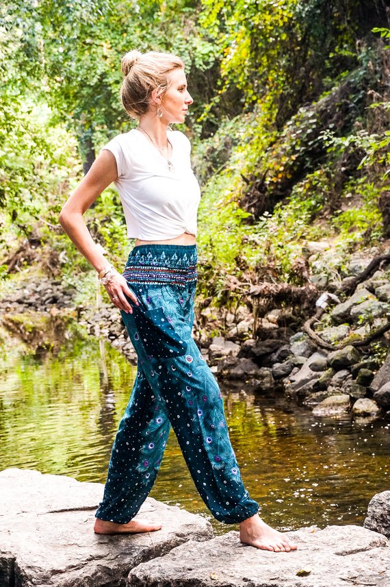 Teal PEACOCK Pants for women, featuring a vibrant peacock pattern, elastic waist, and ankle, made from lightweight breathable rayon, perfect for yoga and casual wear.