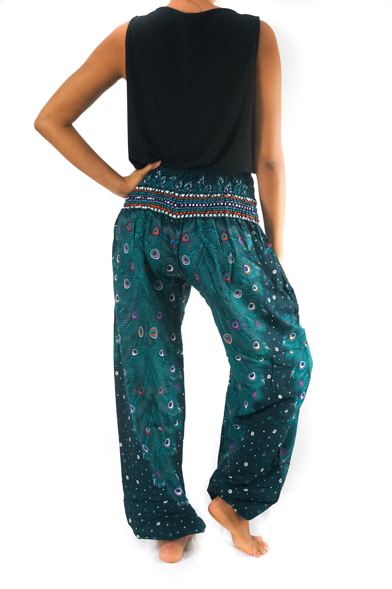 Teal PEACOCK Pants for women, featuring a vibrant peacock pattern, elastic waist, and ankle, made from lightweight breathable rayon, perfect for yoga and casual wear.