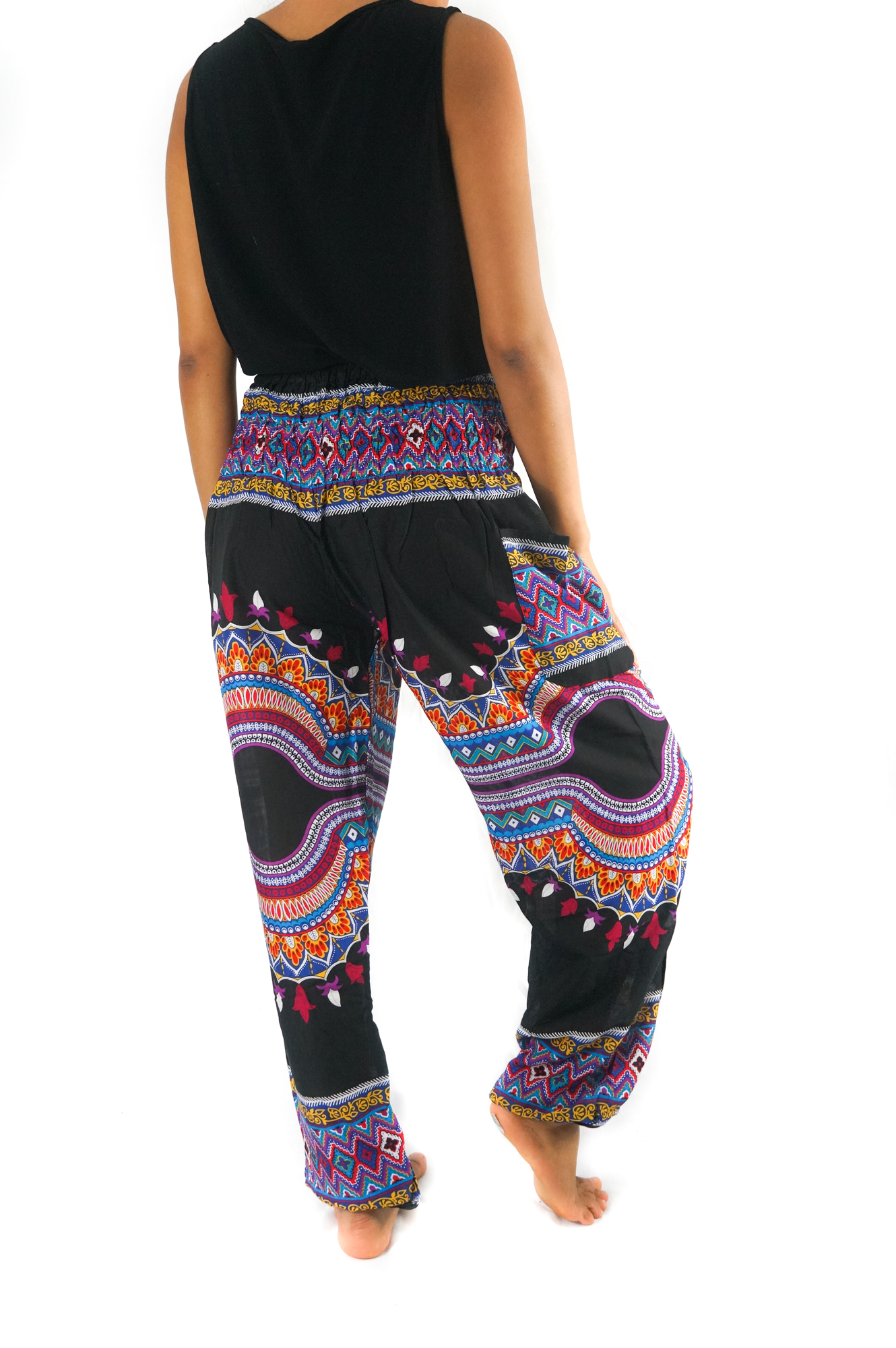 A pair of vibrant Tribal Harem Pants made from 100% rayon, featuring an elastic waist and ankle, perfect for bohemian style and comfort.