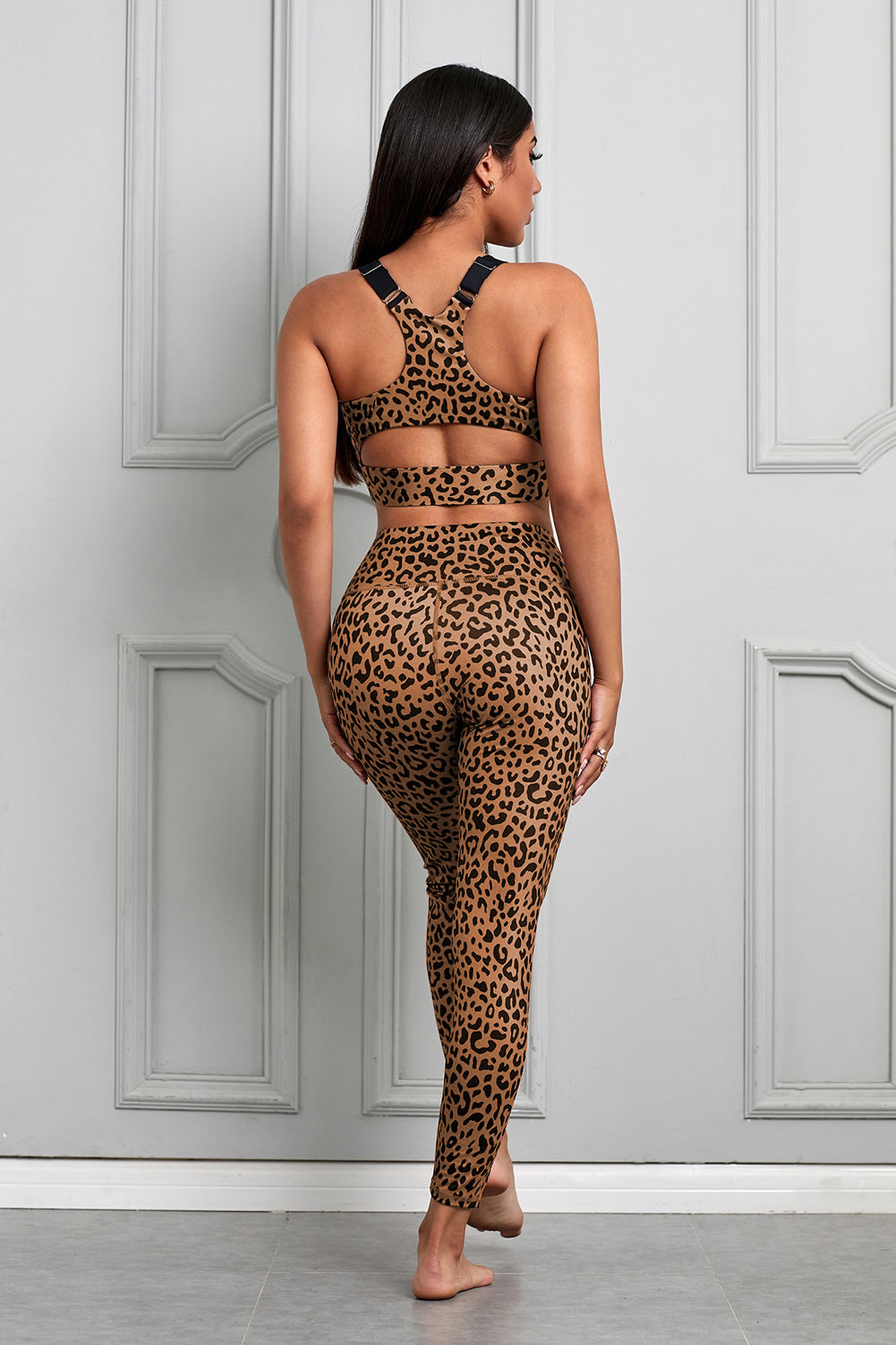 Women Brown Cheetah Print Sport Bra Pants Set featuring a stylish cheetah print design, adjustable straps, and high waist leggings for comfort and support.