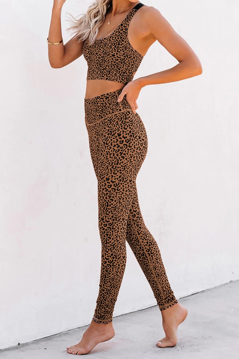 Women Brown Cheetah Print Sport Bra Pants Set featuring a stylish cheetah print design, adjustable straps, and high waist leggings for comfort and support.