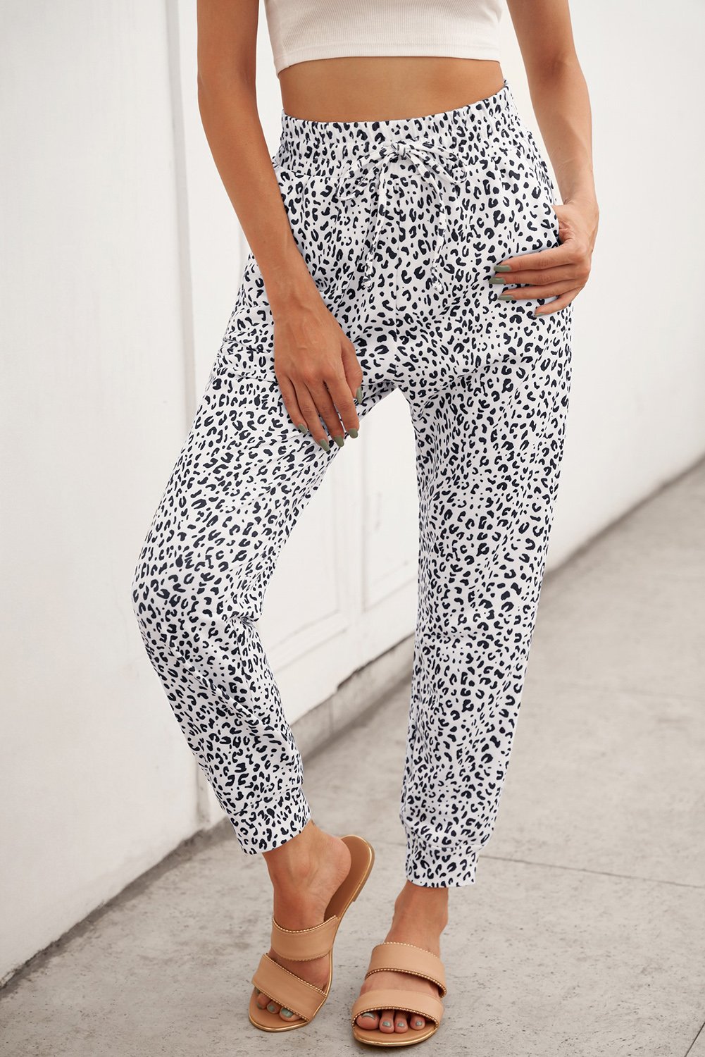 Women's Casual White Breezy Leopard Joggers featuring a stylish leopard print and adjustable smocked waist for a comfortable fit.