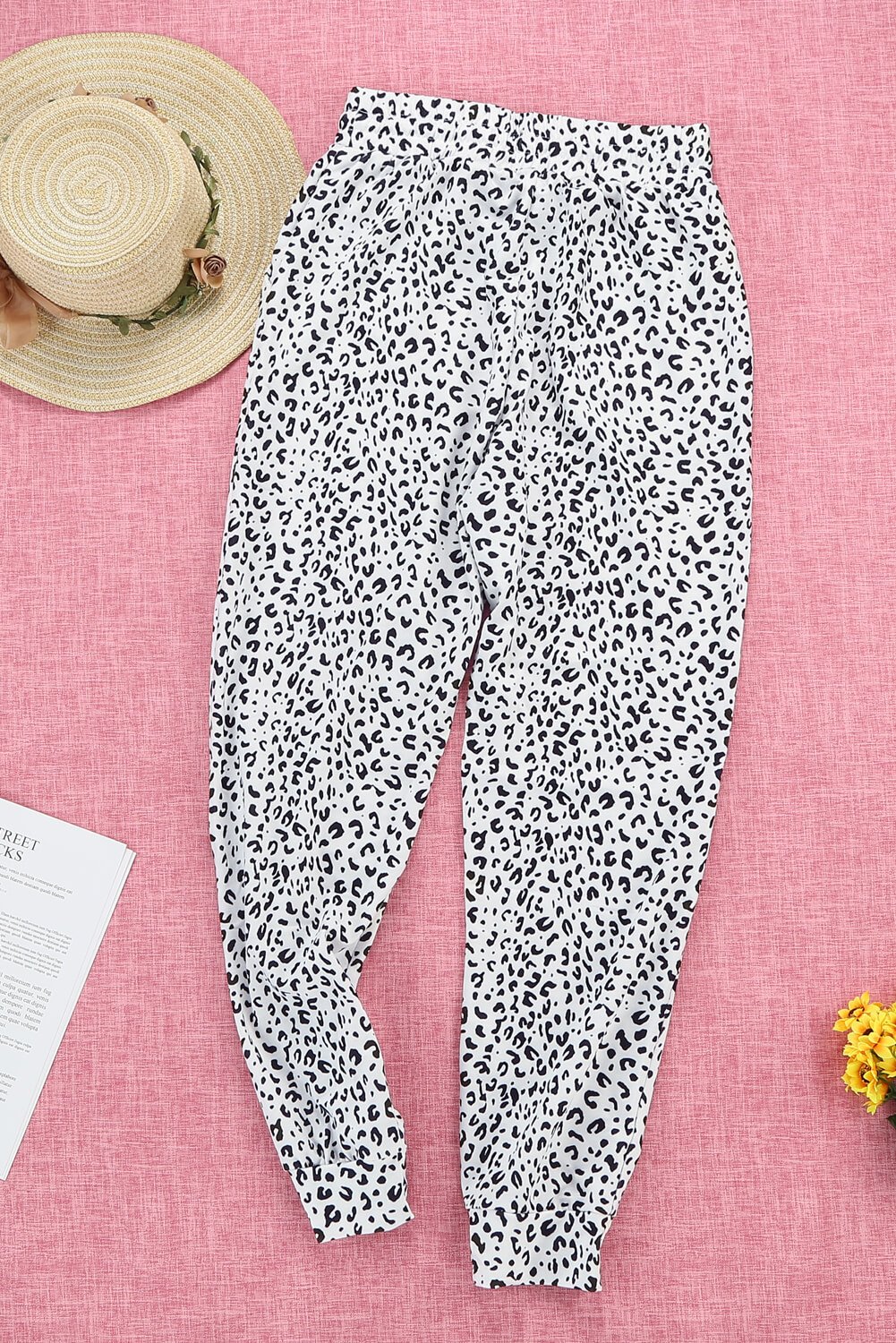 Women's Casual White Breezy Leopard Joggers featuring a stylish leopard print and adjustable smocked waist for a comfortable fit.