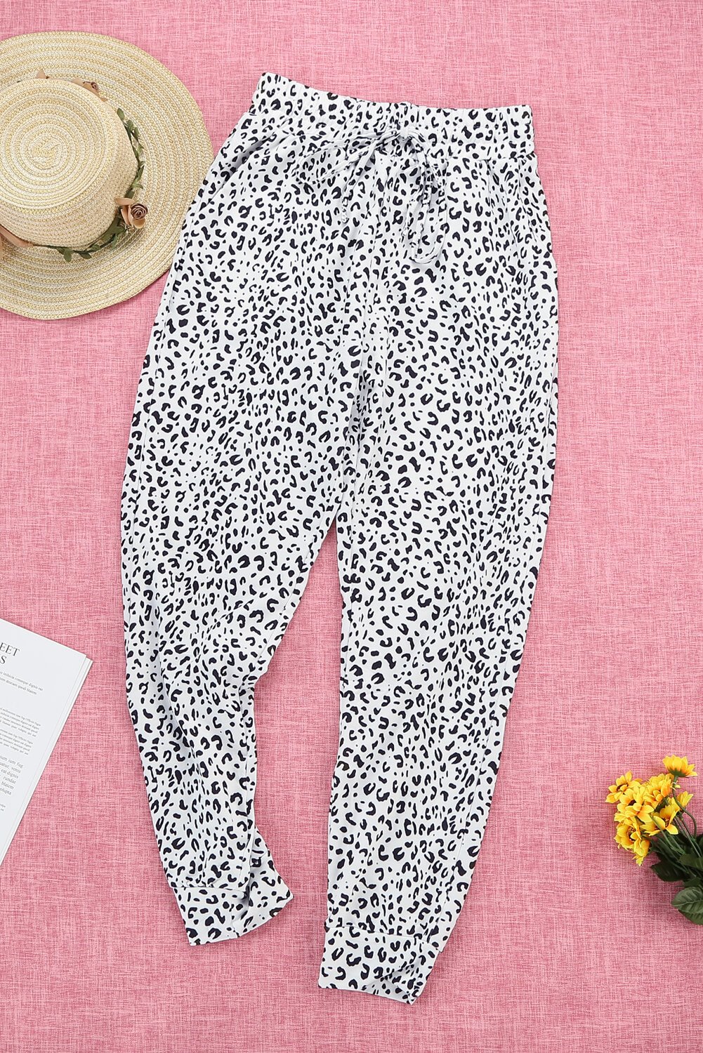 Women's Casual White Breezy Leopard Joggers featuring a stylish leopard print and adjustable smocked waist for a comfortable fit.