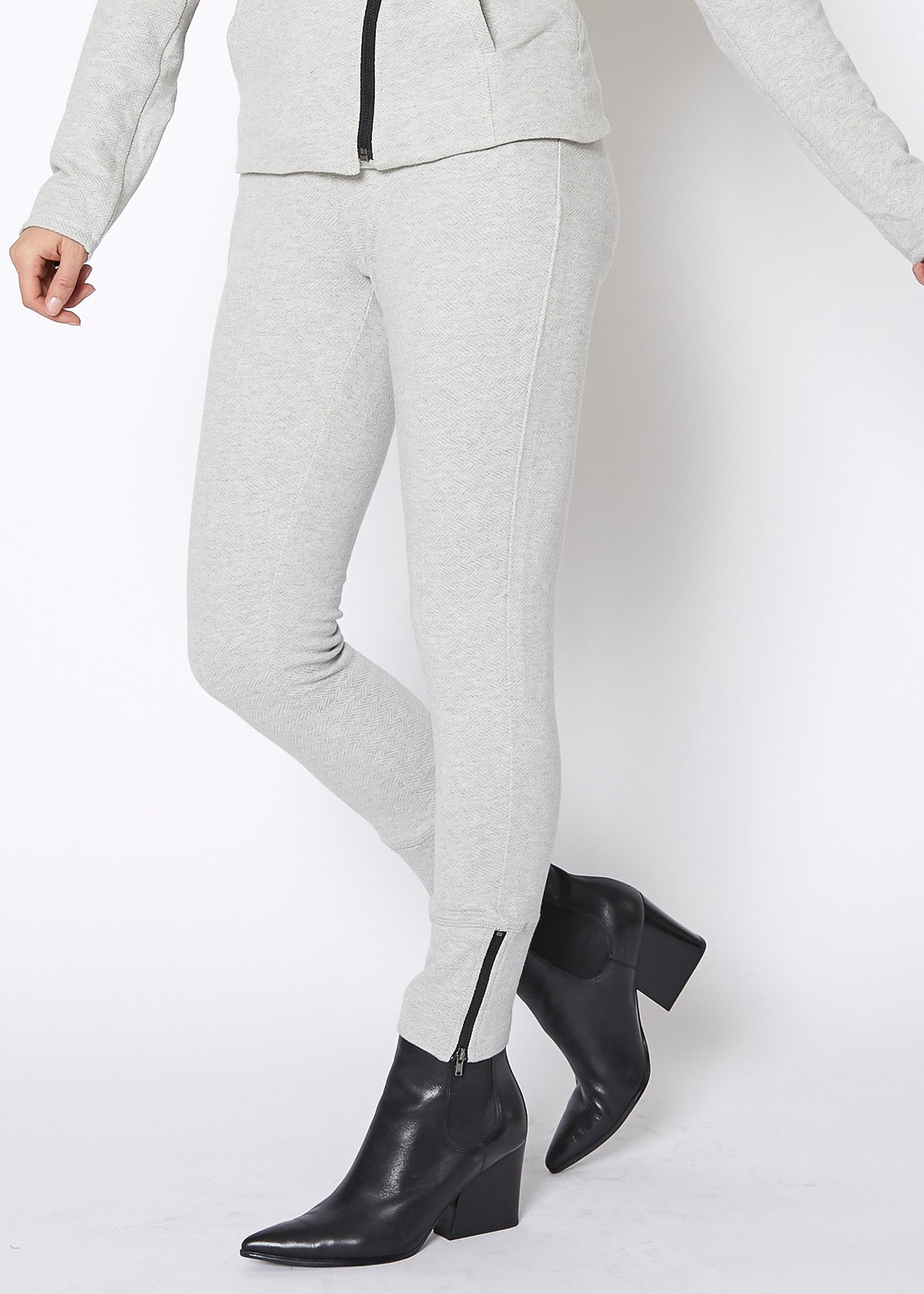 Women's Heather Grey Drawstring Waist Fitted Jogger Pants with Zipper Hem, showcasing a casual and stylish design.