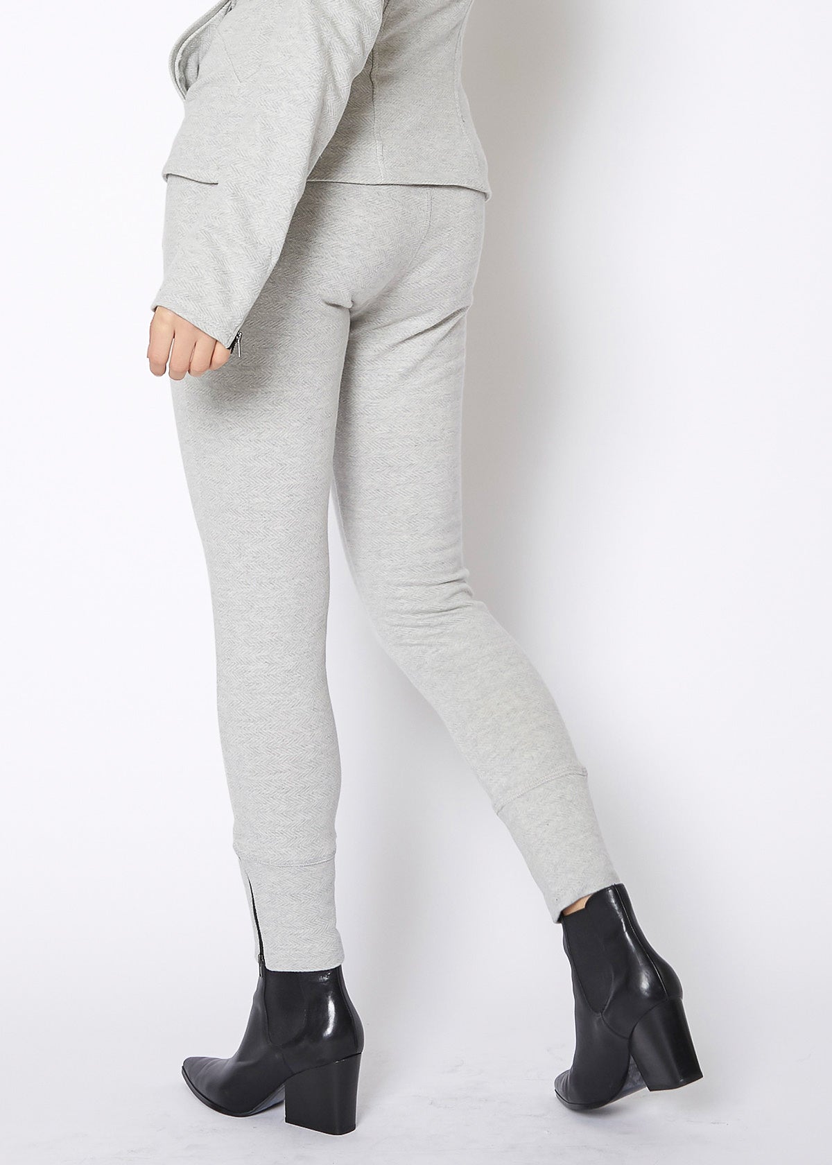 Women's Heather Grey Drawstring Waist Fitted Jogger Pants with Zipper Hem, showcasing a casual and stylish design.