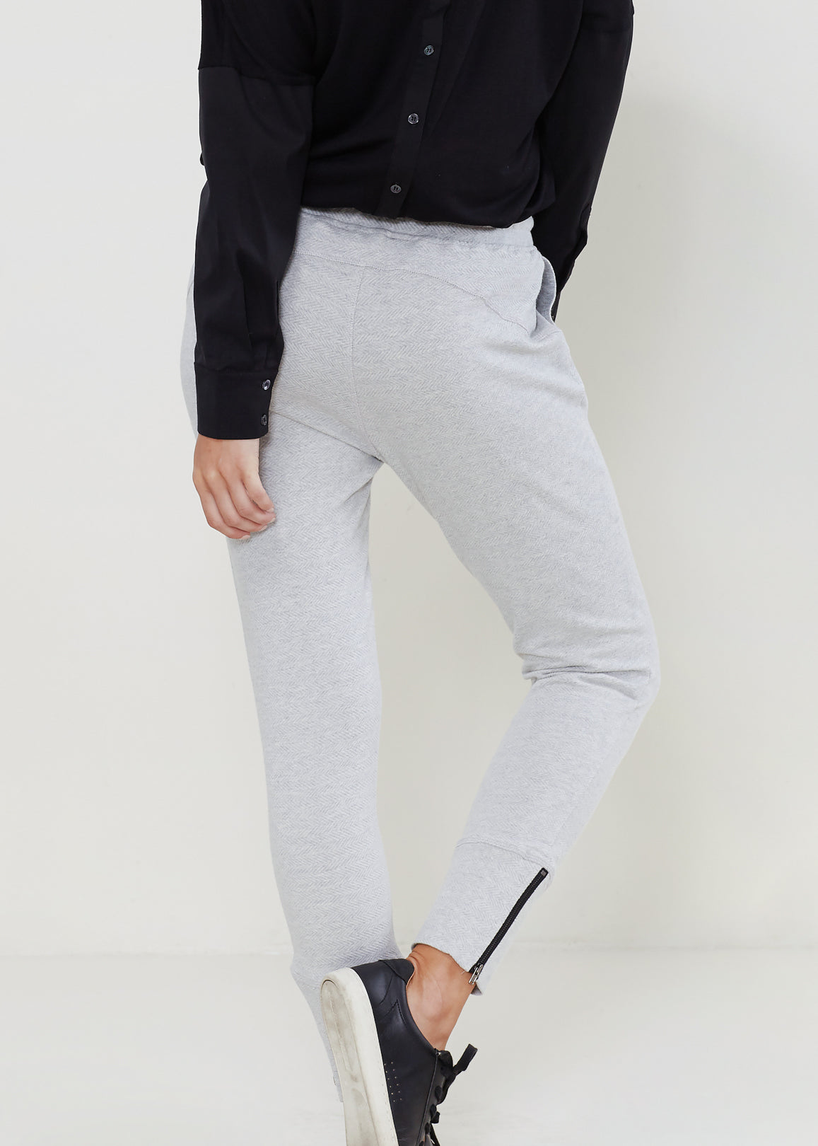 Women's Heather Grey Drawstring Waist Fitted Jogger Pants with Zipper Hem, showcasing a casual and stylish design.