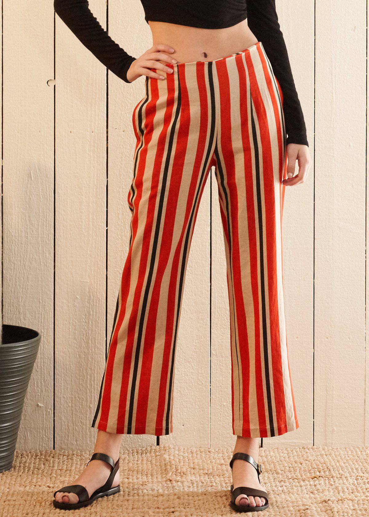 Women's hi-waisted cropped pants in vibrant poppy red stripe with side pockets and rear zipper detail.