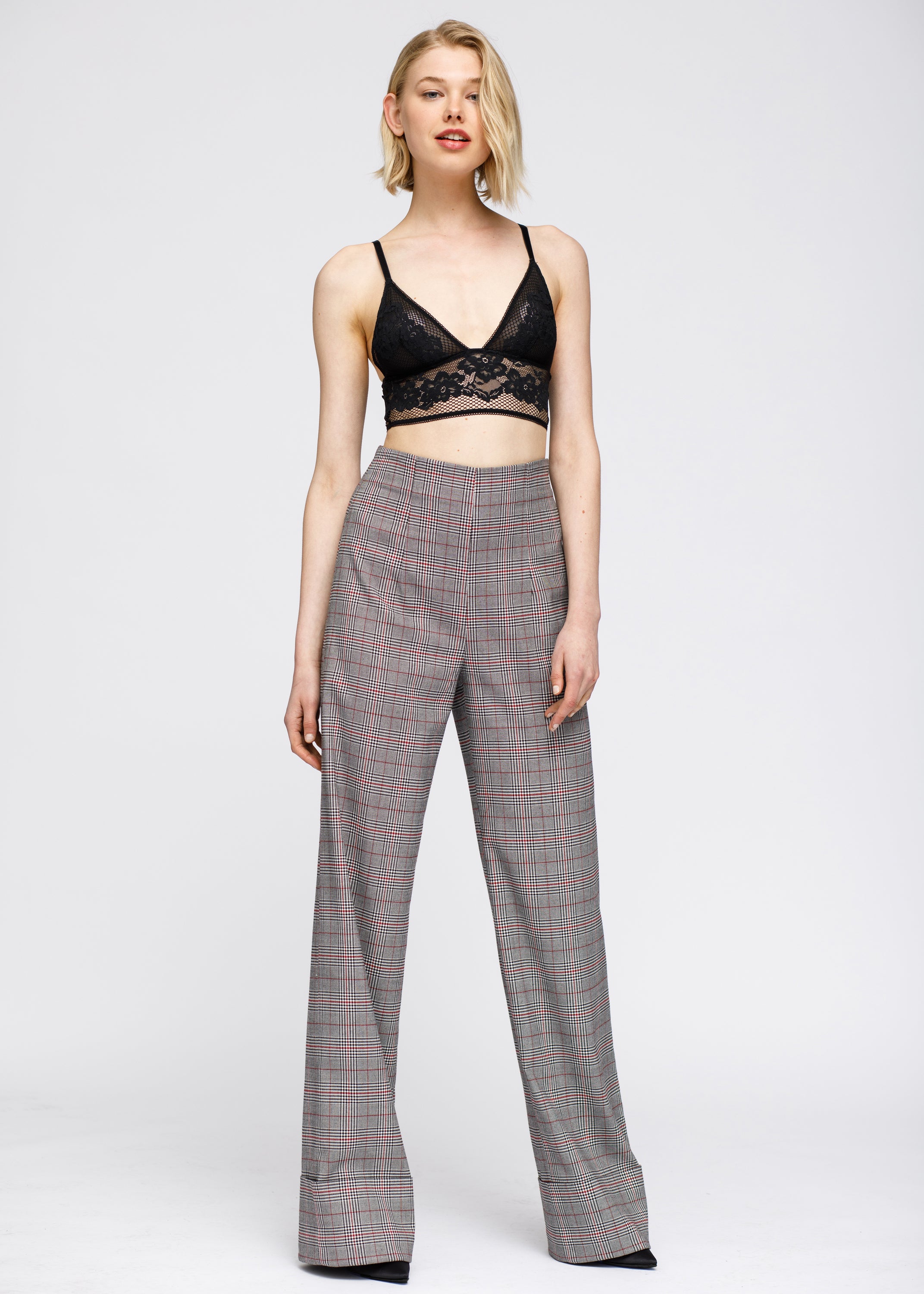 Women's grey plaid high waist wide leg pants featuring a multi glen plaid pattern, cuffed hem, and hidden side zipper closure.