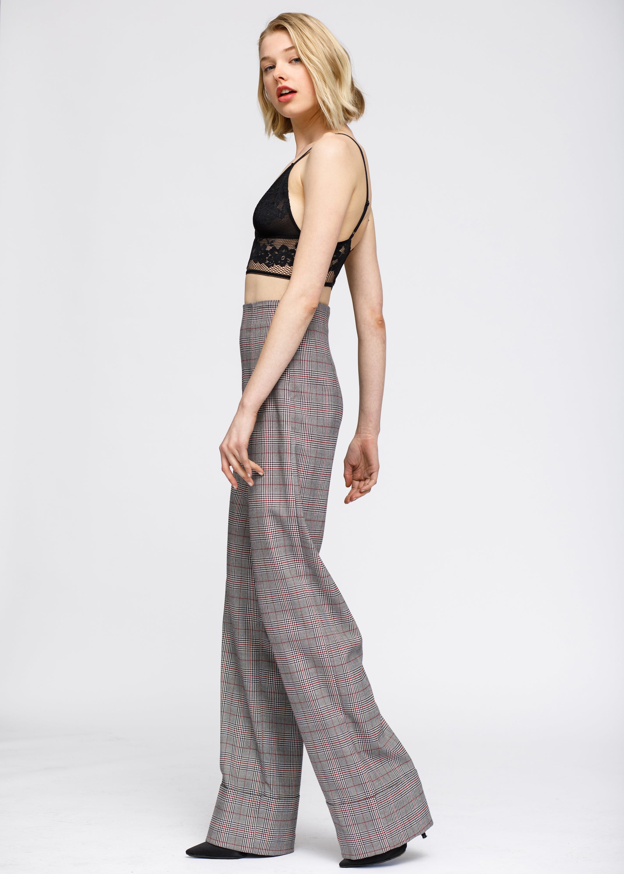 Women's grey plaid high waist wide leg pants featuring a multi glen plaid pattern, cuffed hem, and hidden side zipper closure.