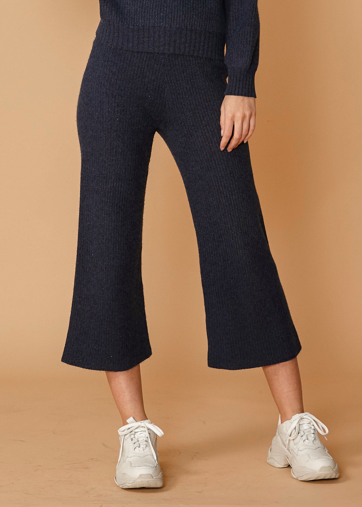 Women's high-waisted ribbed crop pants in midnight color, showcasing a stylish and comfortable design.