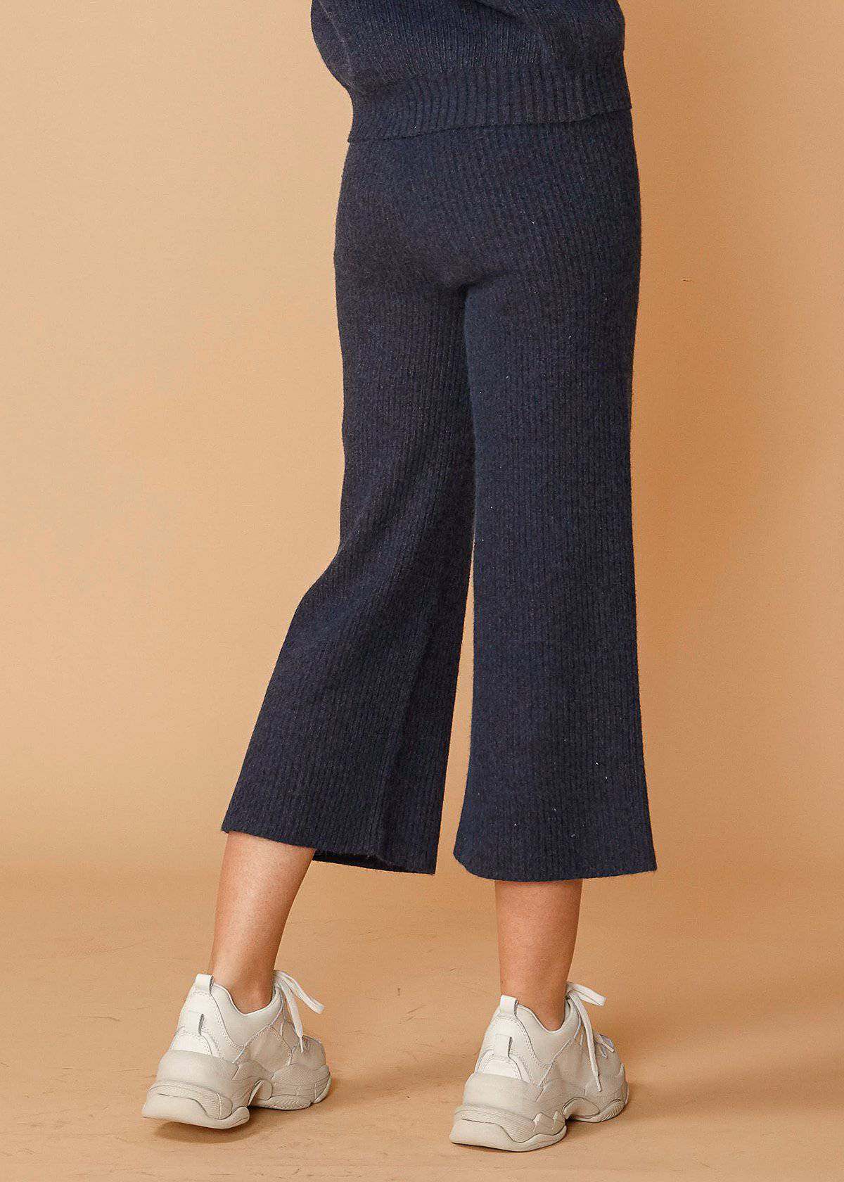 Women's high-waisted ribbed crop pants in midnight color, showcasing a stylish and comfortable design.