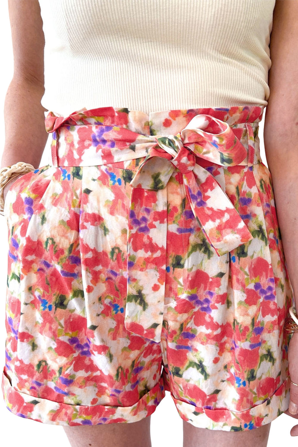 A pair of vibrant abstract floral print high waist shorts with lace-up detail, showcasing a stylish and trendy design.