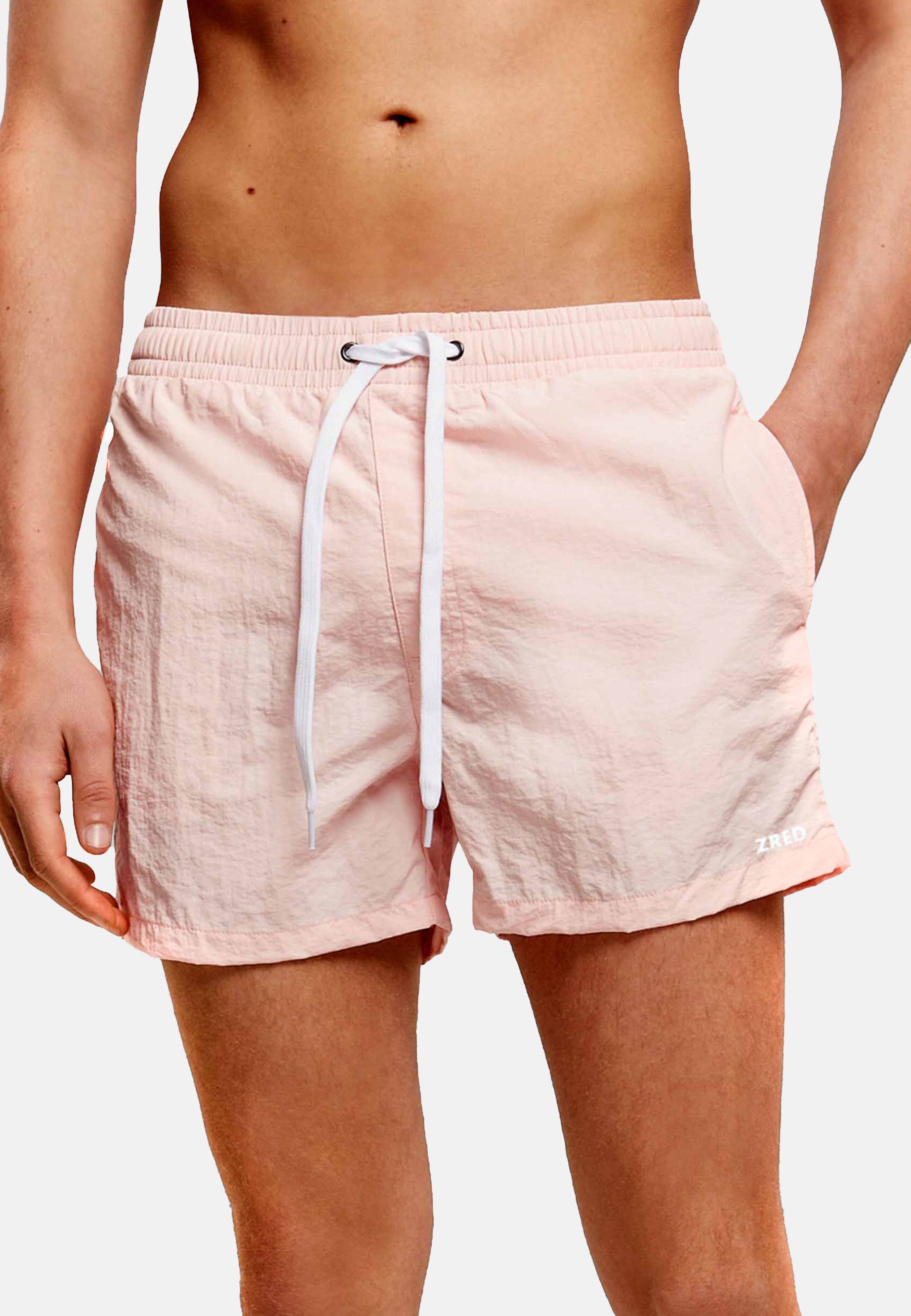 Men's Beach Shorts ICON in four stylish colors, featuring a zippered back pocket and made from lightweight, quick-drying fabric.