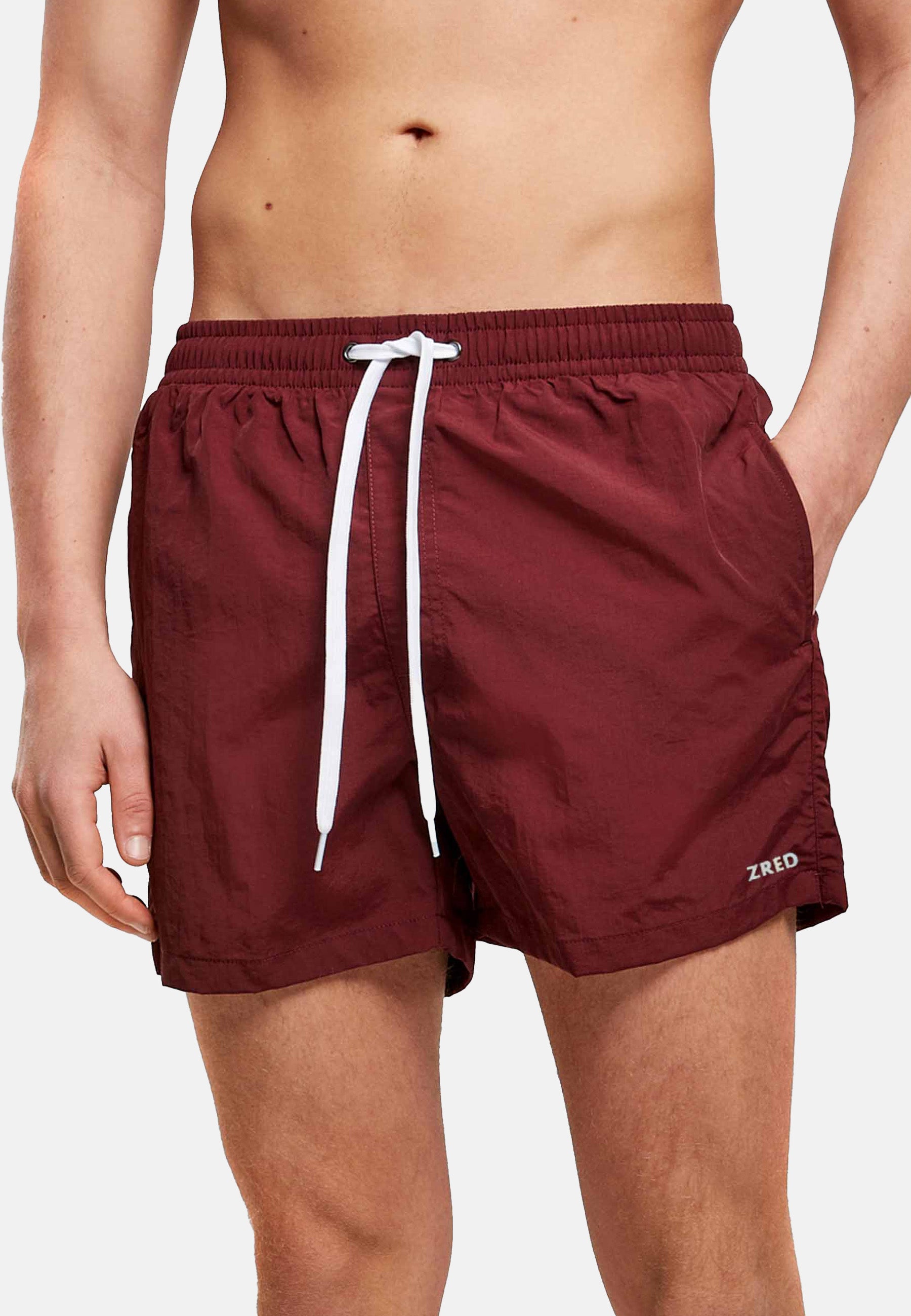 Men's Beach Shorts ICON in four stylish colors, featuring a zippered back pocket and made from lightweight, quick-drying fabric.