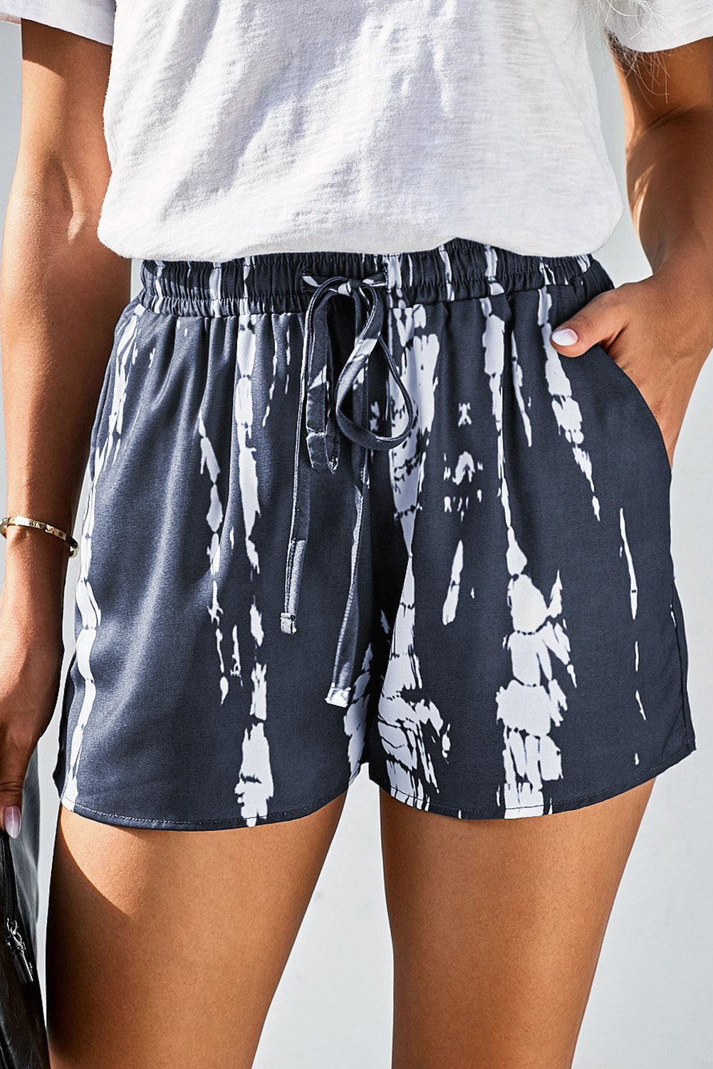 Gray and white tie dye casual shorts with drawstring waistband and side pockets, perfect for summer wear.