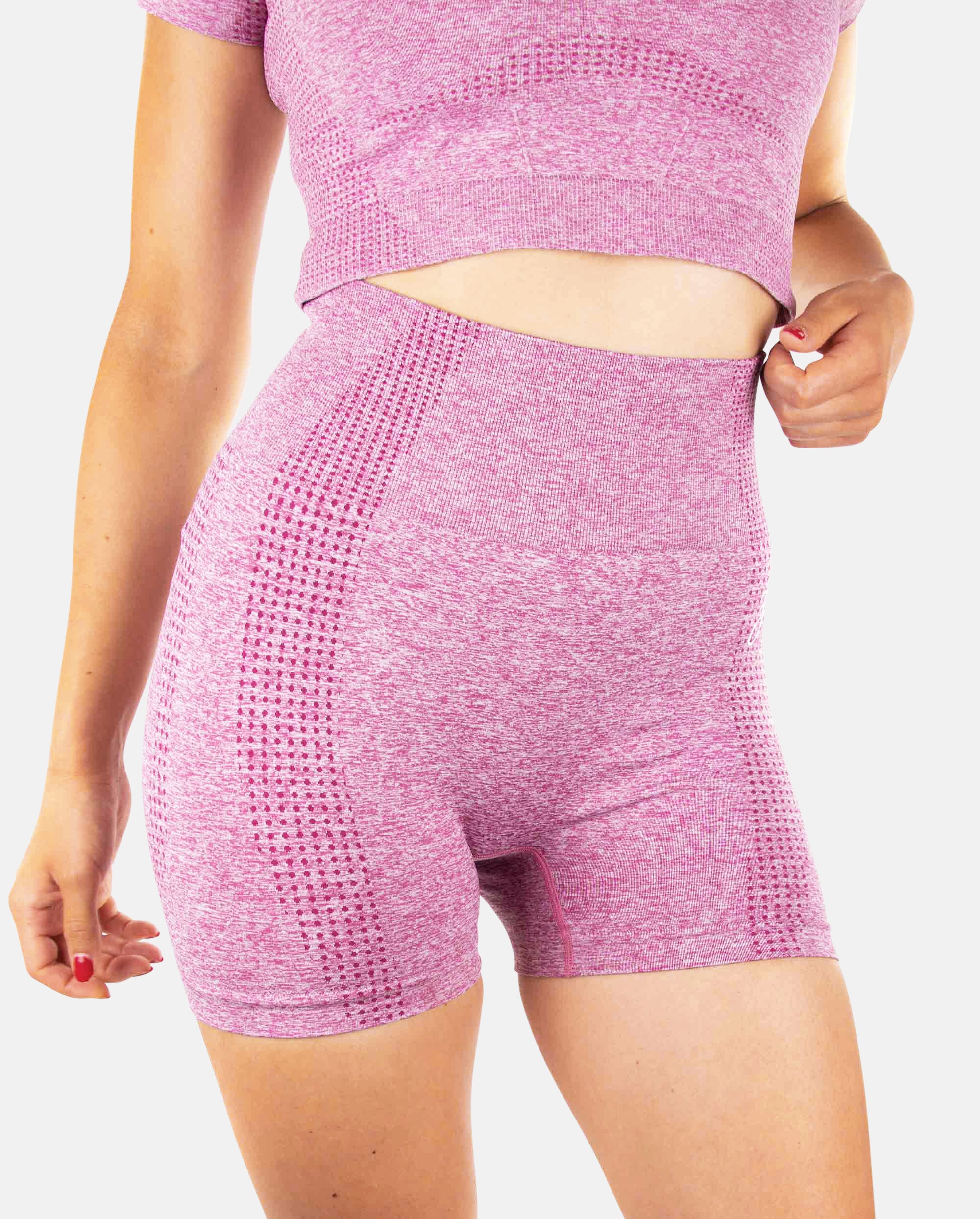 A pair of pink women's shorts from the DYNAMIC collection, showcasing a snug fit and stylish design, perfect for sports and casual wear.