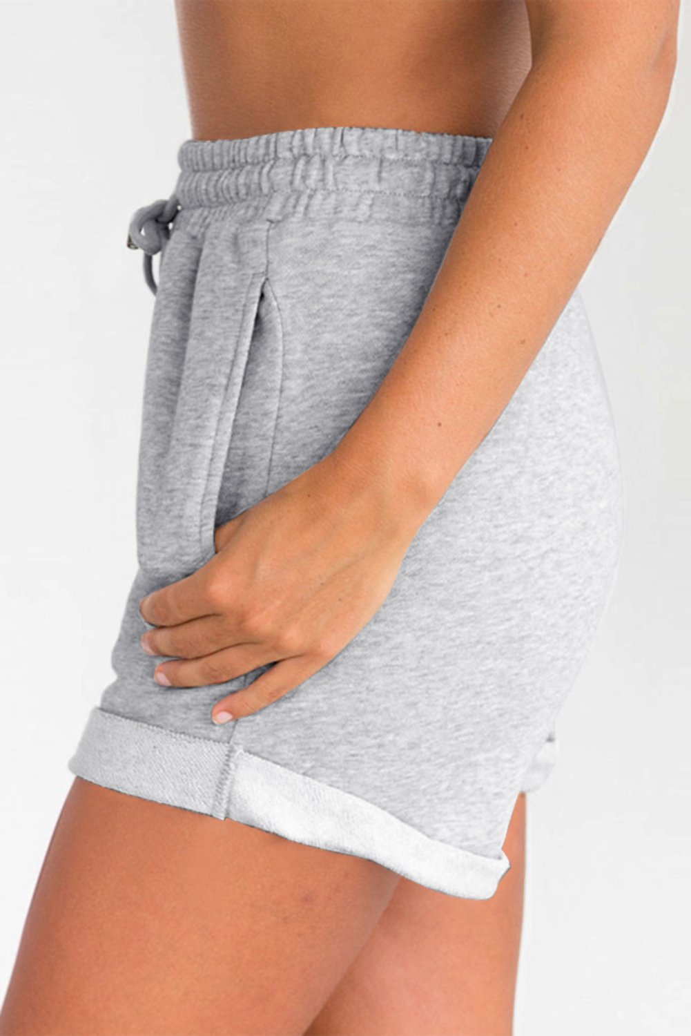 A pair of gray cuffed lounge shorts for women featuring a tie waist and side pockets, perfect for summer wear.