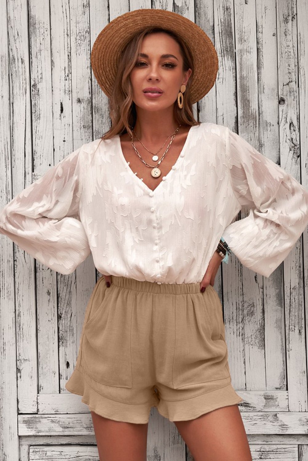 A pair of Women's Casual Pocketed Flutter Khaki Linen Cotton Shorts featuring a soft fabric, elastic waistband, and stylish ruffled hem, perfect for summer wear.