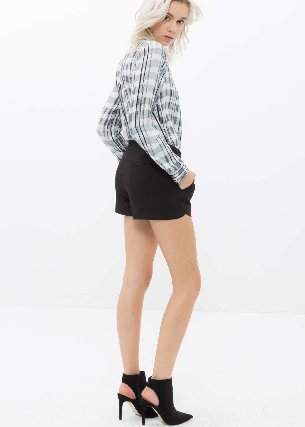 A pair of women's gabardine mid-rise shorts in a stylish design, featuring side pockets and a faux back pocket, perfect for summer wear.