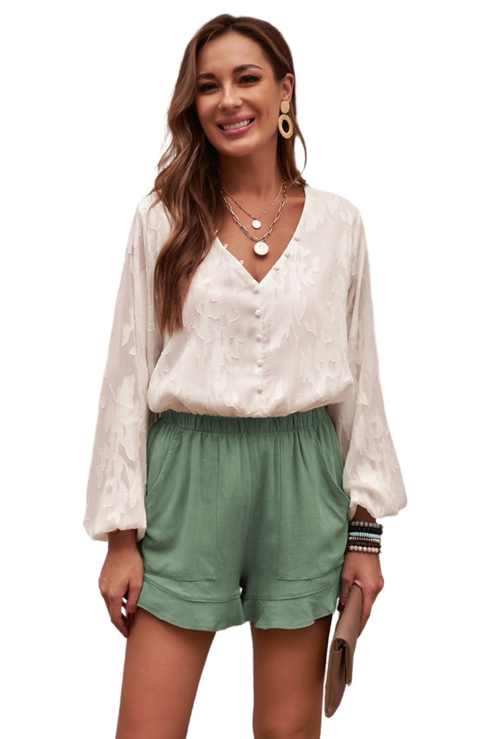 A pair of Women's Summer Pocketed Flutter Green Linen Cotton Shorts featuring ruffled details and side pockets, perfect for summer wear.