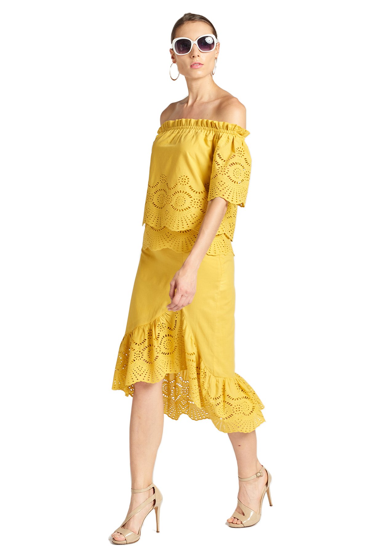 Aster Skirt in marigold, featuring cotton eyelet fabric, asymmetric hi-lo design, and scalloped ruffle hem, perfect for summer outings.