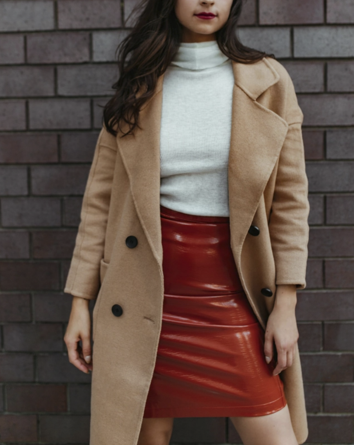 Berlin Rock ‘n’ Roll Vinyl Skirt in burnt orange, made of vegan leather with a concealed side zip and back slit for ease of movement.