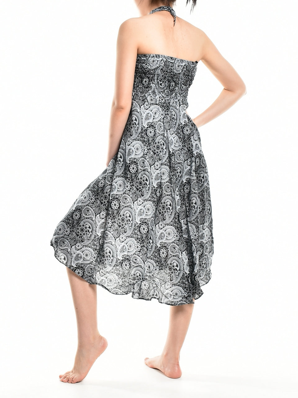 Bohotusk Black Orbit Long Skirt featuring a coconut buckle and smocked waist, styled as a strapless dress.