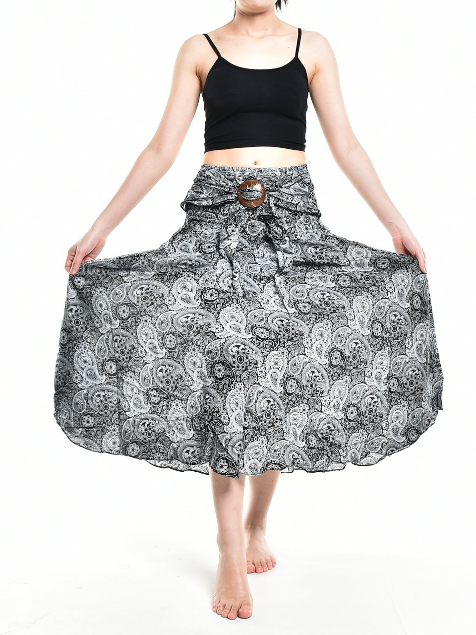 Bohotusk Black Orbit Long Skirt featuring a coconut buckle and smocked waist, styled as a strapless dress.