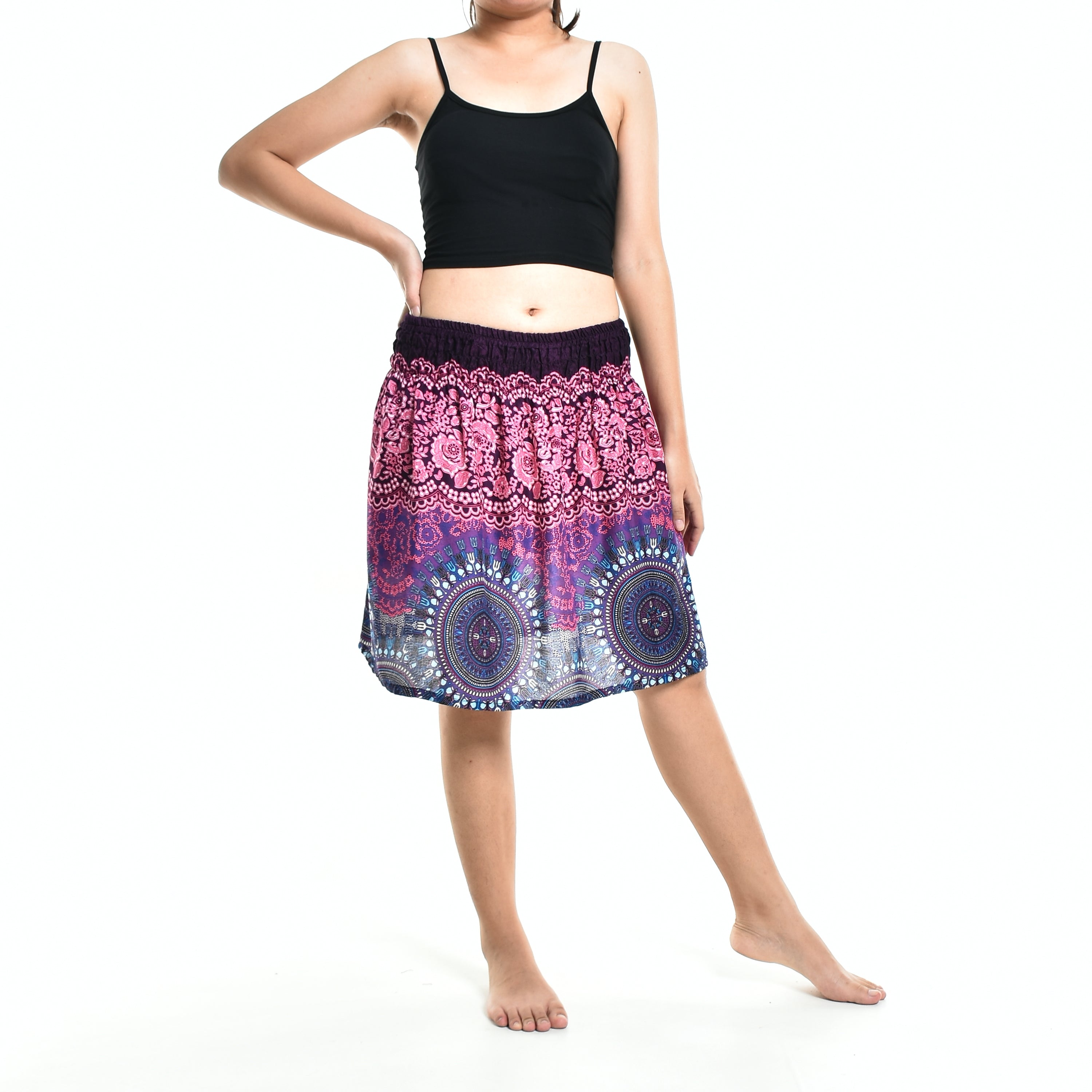 Bohotusk Pink Blue Sun Glow Print Short Skirt hanging on a display, showcasing its vibrant colors and elasticated waist.