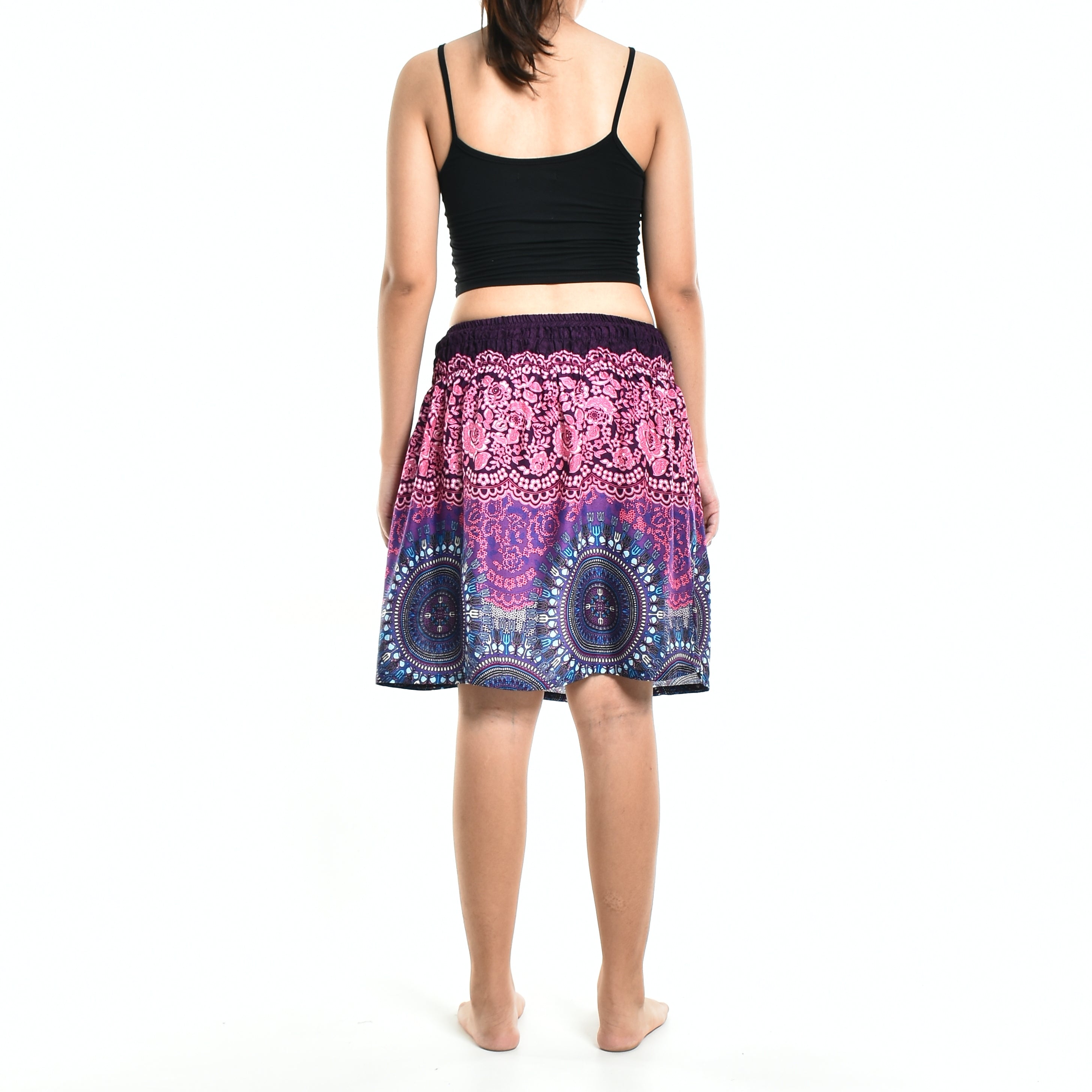 Bohotusk Pink Blue Sun Glow Print Short Skirt hanging on a display, showcasing its vibrant colors and elasticated waist.